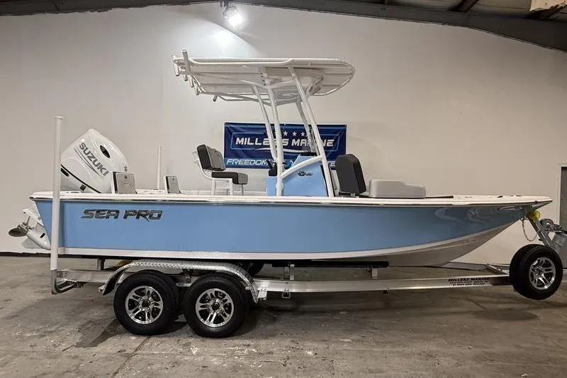 The Image of 2026 Sea Pro 210 Bay boat on trailer in showroom. - 0