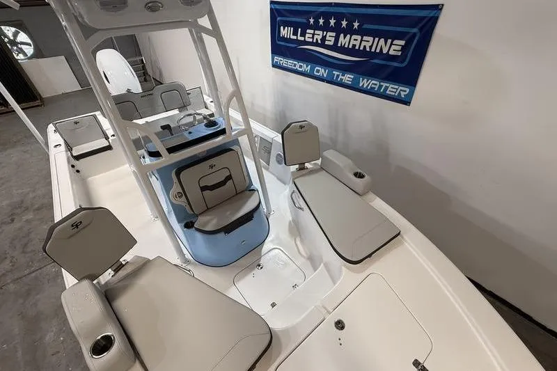 Slide: The Image of 2026 Sea Pro 210 Bay boat interior at Miller's Marine showroom. - 20