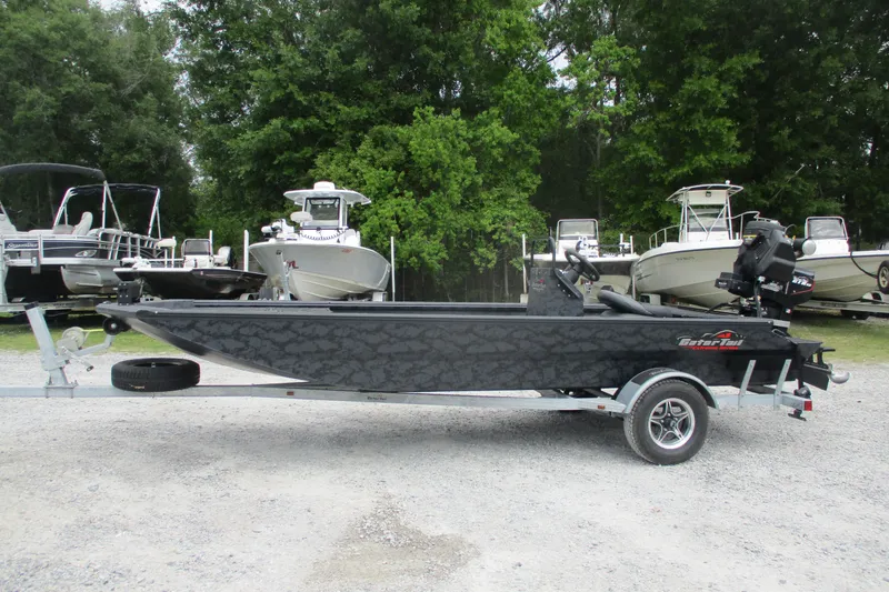 The Image of 2026 Gator Tail 1860 Extreme CC boat on trailer, surrounded by trees and other boats. - 0