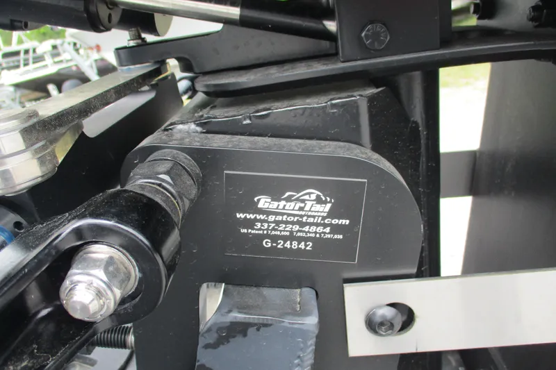 Slide: The Image of Close-up of Gator Tail 1860 Extreme CC 2026 boat component with branding and contact details. - 10