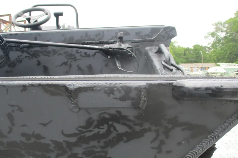 Slide: The Image of 2026 Gator Tail 1860 Extreme CC boat with steering wheel and control lever. - 11