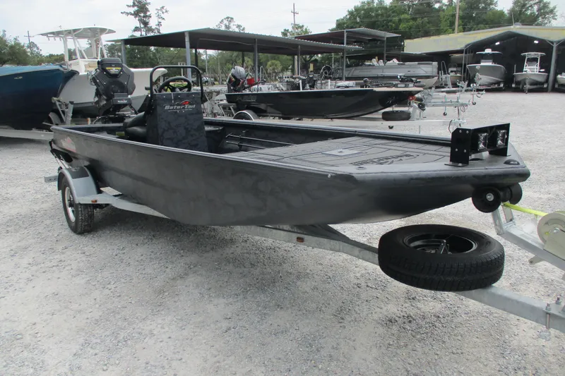 Slide: The Image of 2026 Gator Tail 1860 Extreme CC boat on trailer in outdoor showroom. - 2