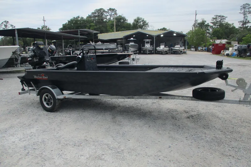 Slide: The Image of 2026 Gator Tail 1860 Extreme CC boat on trailer in outdoor dealership setting. - 3