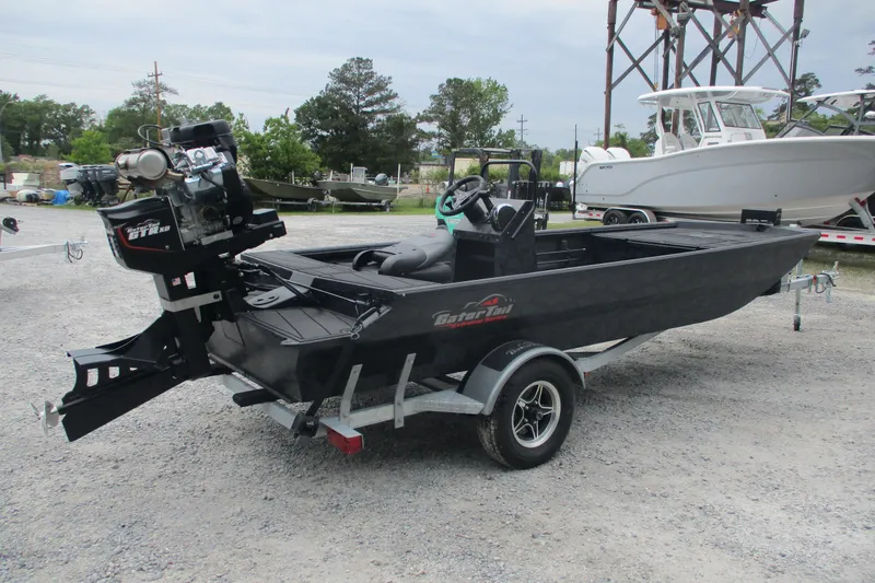 Slide: The Image of 2026 Gator Tail 1860 Extreme CC boat on trailer, parked outdoors. - 4
