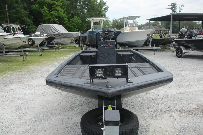 Slide: The Image of 2026 Gator Tail 1860 Extreme CC boat on trailer, surrounded by other boats. - 7