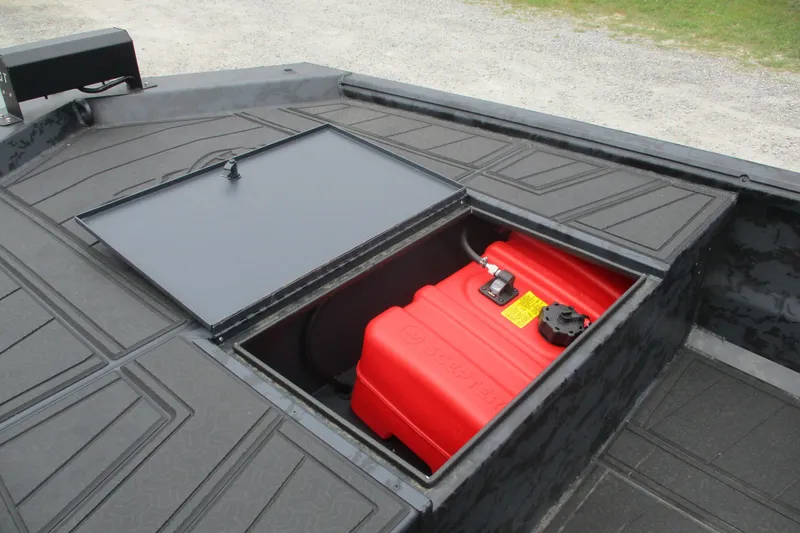 Slide: The Image of 2026 Gator Tail 1860 Extreme CC boat with open storage compartment and red fuel tank. - 9