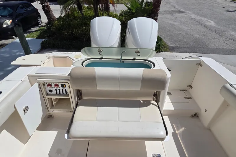 Slide: The Image of 2010 Pursuit S 280 Sport boat interior with seating and control panel. - 3
