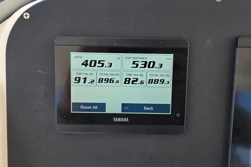 Slide: The Image of Yamaha display showing fuel usage and trip distance on Pursuit S 280 Sport boat. - 8