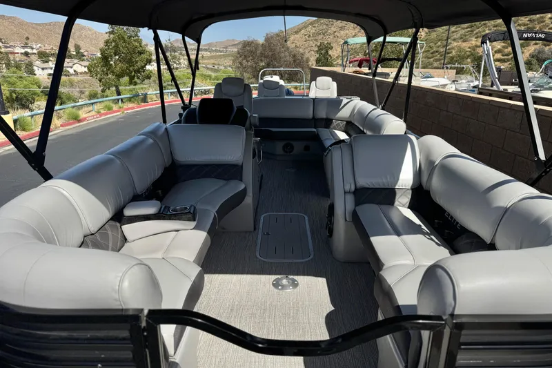 Slide: The Image of 2023 SunCatcher Elite 326 SE pontoon boat with spacious seating and canopy. - 10