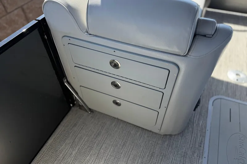 Slide: The Image of 2023 SunCatcher Elite 326 SE boat seat with integrated storage drawers. - 13