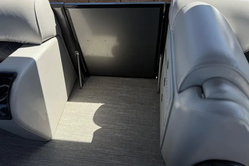 Slide: The Image of 2023 SunCatcher Elite 326 SE interior with gray seating and carpeted flooring. - 16