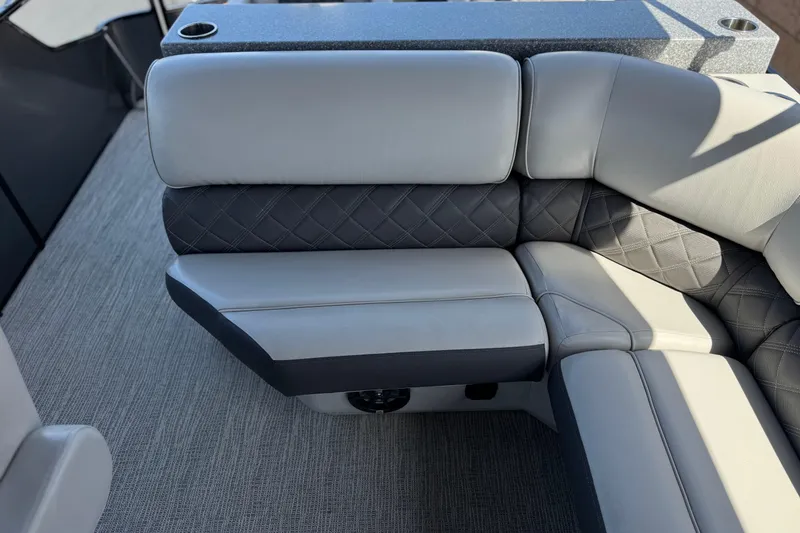 Slide: The Image of 2023 SunCatcher Elite 326 SE boat interior with luxurious seating and cup holders. - 21