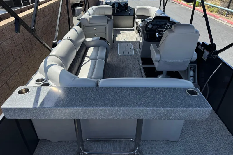 Slide: The Image of Interior of 2023 SunCatcher Elite 326 SE pontoon boat with luxurious seating and helm. - 24