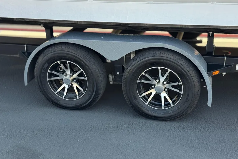 Slide: The Image of 2023 SunCatcher Elite 326 SE trailer wheels with stylish black and silver rims. - 30