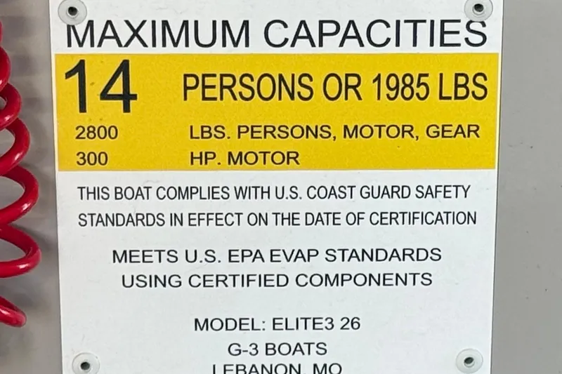 Slide: The Image of Capacity label for 2023 SunCatcher Elite 326 SE, 14 persons or 1985 lbs, safety standards compliant. - 32