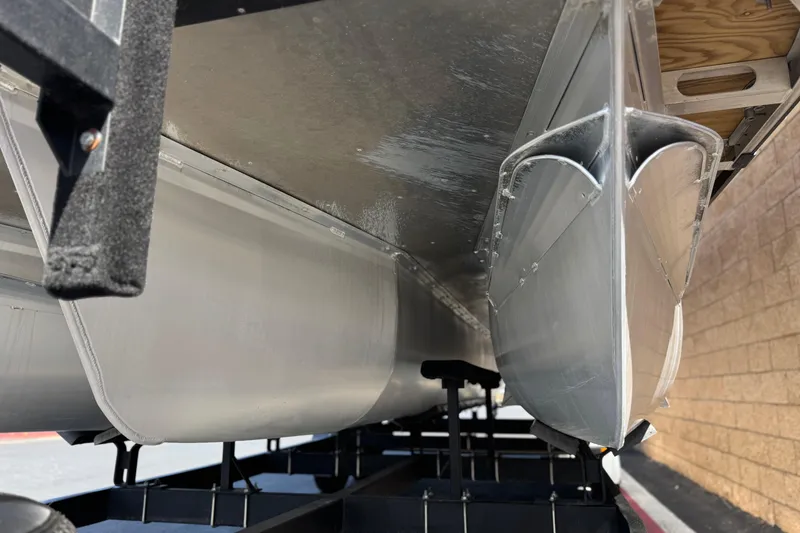 Slide: The Image of Underneath view of 2023 SunCatcher Elite 326 SE pontoon boat on trailer. - 4