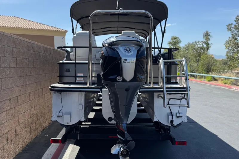 Slide: The Image of 2023 SunCatcher Elite 326 SE pontoon boat with Yamaha outboard motor on trailer. - 5