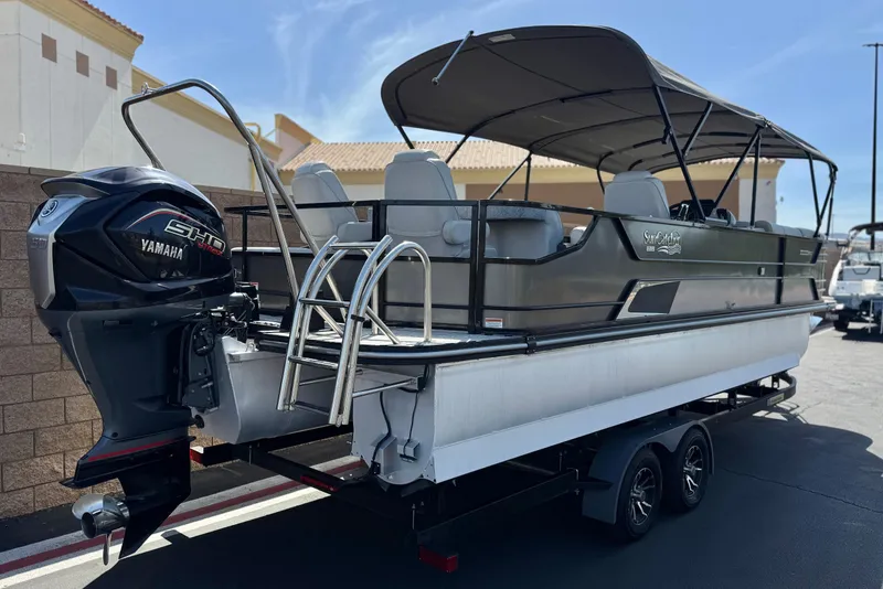 Slide: The Image of 2023 SunCatcher Elite 326 SE pontoon boat with Yamaha engine, parked on a trailer. - 6