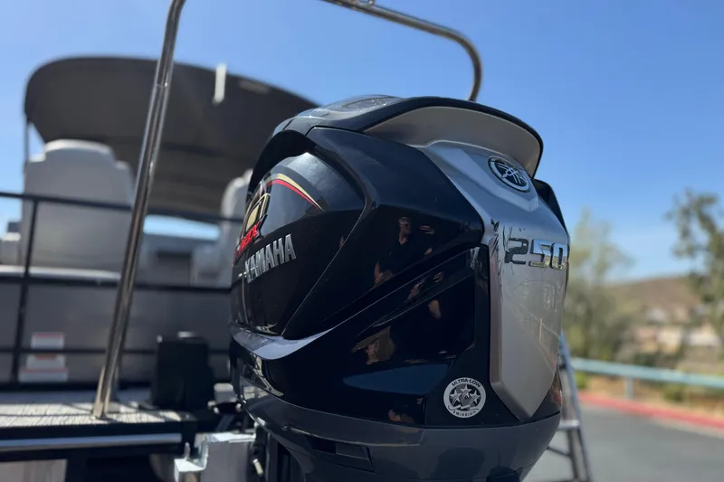 Slide: The Image of 2023 SunCatcher Elite 326 SE with Yamaha 250 outboard motor, outdoor setting. - 8