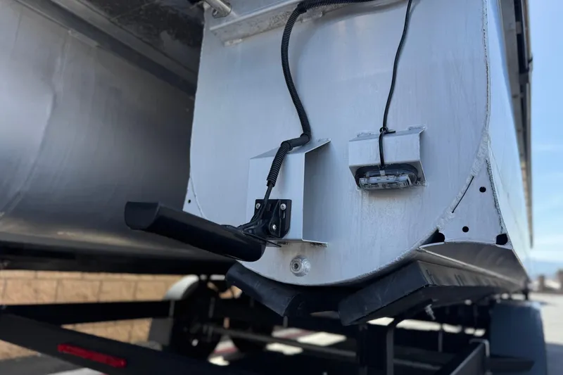 Slide: The Image of 2023 SunCatcher Elite 326 SE pontoon boat underside with wiring and components visible. - 9