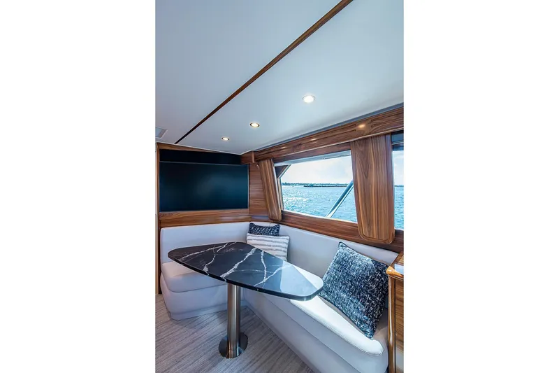 Slide: The Image of Interior of Viking 54 Convertible 2026 with elegant dining table. - 34