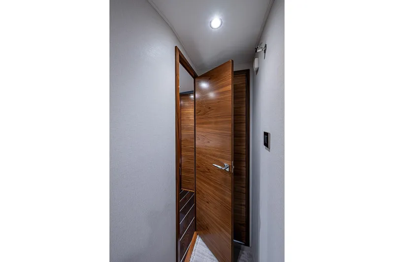 Slide: The Image of Interior of Viking 54 Convertible 2026 with wooden door. - 47