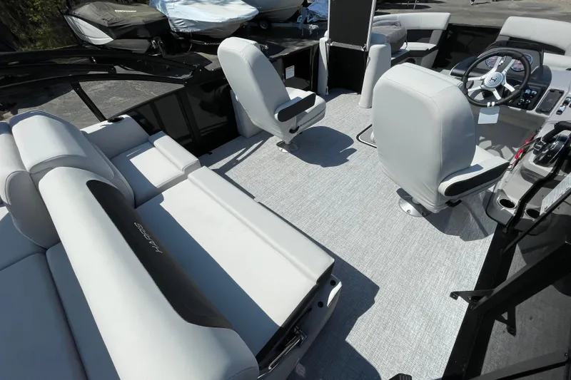 Slide: The Image of Interior of 2026 Harris Cruiser 230 SLDH pontoon boat with modern seating and helm. - 12