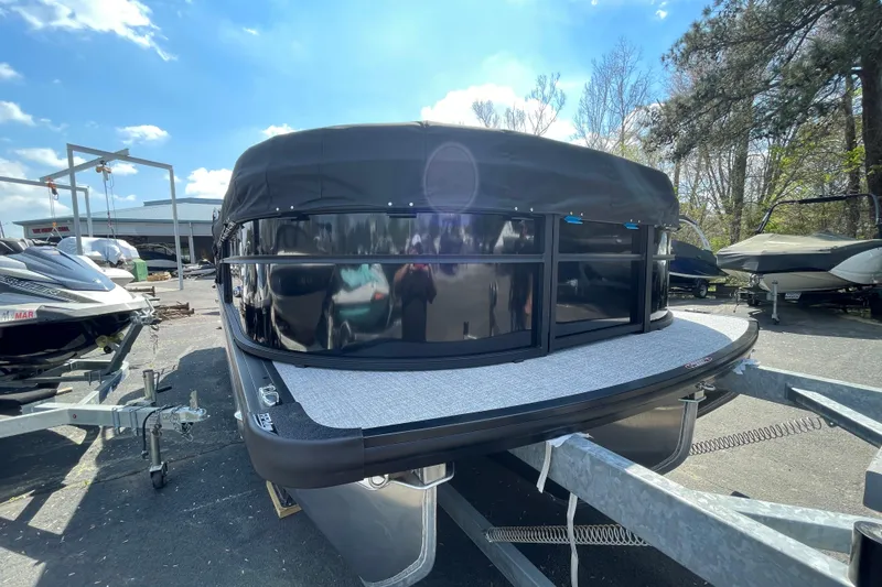Slide: The Image of 2026 Harris Cruiser 230 SLDH pontoon boat on trailer under sunny sky. - 18