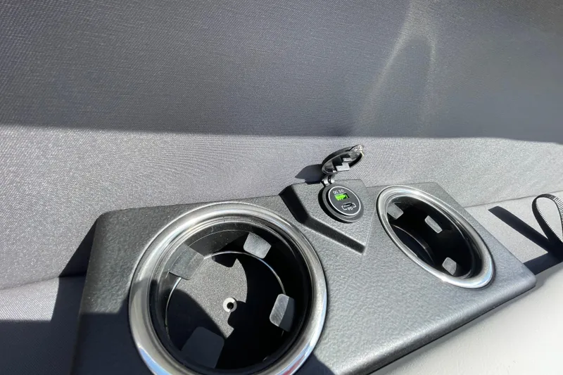 Slide: The Image of Cup holders and USB port in 2026 Harris Cruiser 230 SLDH boat interior. - 4