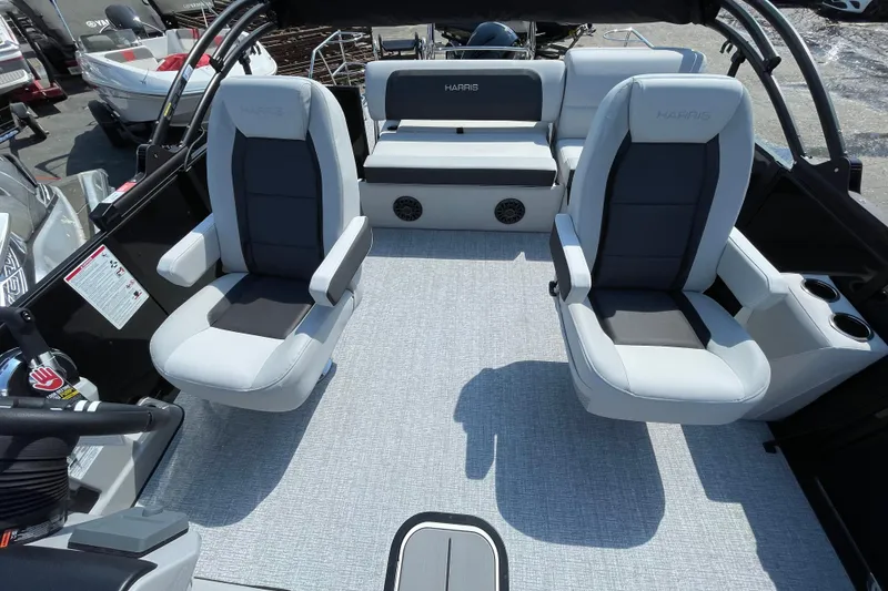 Slide: The Image of 2026 Harris Cruiser 230 SLDH interior with modern seating and sleek design. - 6
