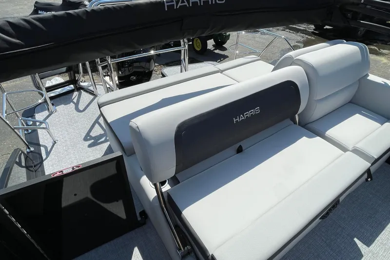 Slide: The Image of 2026 Harris Cruiser 230 SLDH pontoon boat with spacious seating and sleek design. - 8