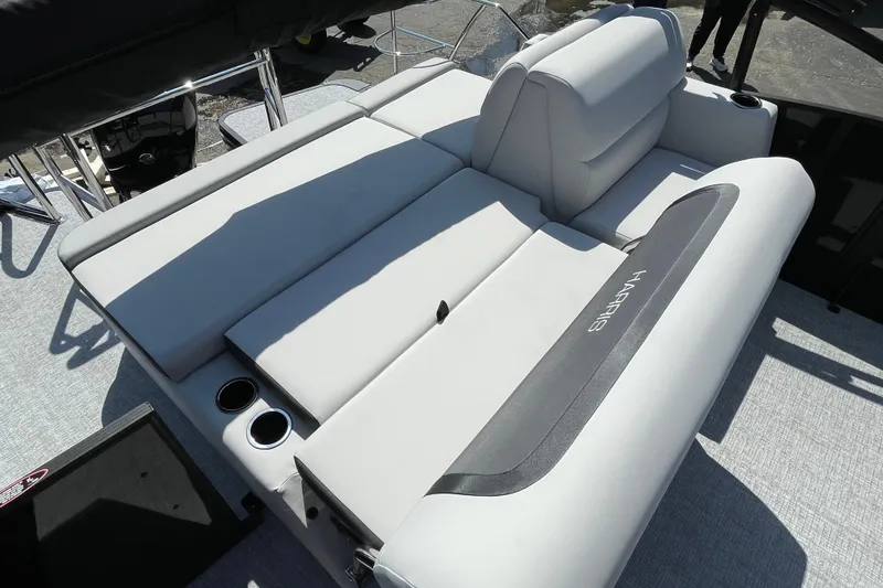 Slide: The Image of 2026 Harris Cruiser 230 SLDH boat with luxurious seating and cup holders. - 9