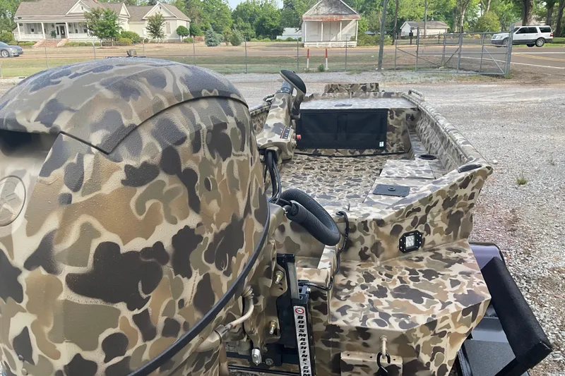 Slide: The Image of Camouflage-patterned 2026 Excel 1751 Viper F4 boat parked outdoors. - 4