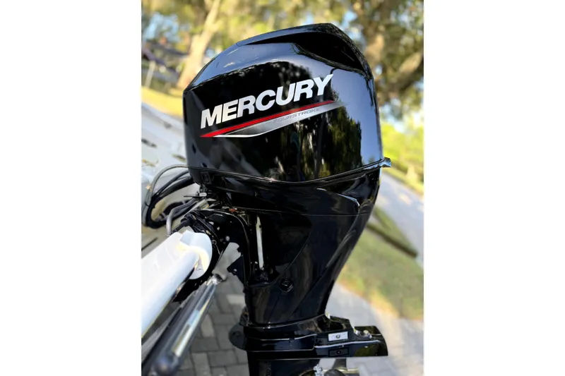 Slide: The Image of Storage compartment of 2023 Boston Whaler 150 Montauk with life jackets and equipment. - 11