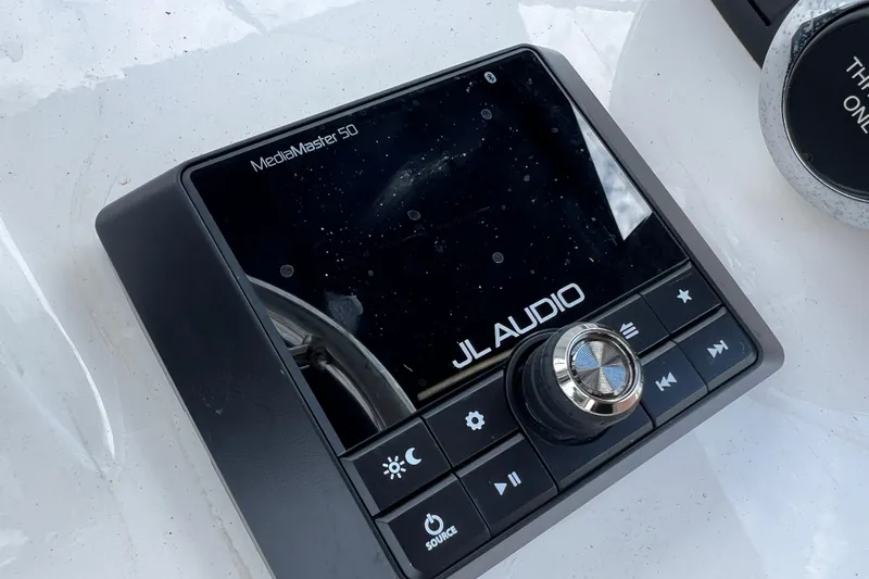 Slide: The Image of JL Audio MediaMaster 50 control panel on 2023 Boston Whaler 150 Montauk boat. - 14