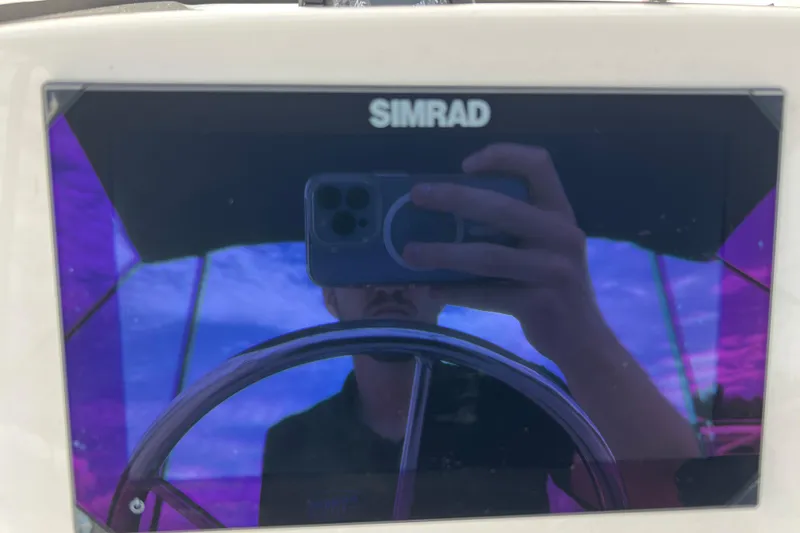 Slide: The Image of Reflection on Simrad display aboard 2023 Boston Whaler 150 Montauk boat. - 16