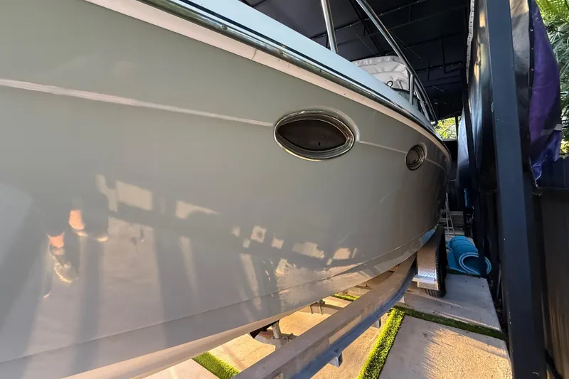 Slide: The Image of 2005 Formula 330 Sun Sport boat on trailer, side view in storage. - 11