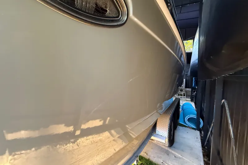 Slide: The Image of 2005 Formula 330 Sun Sport boat side view in storage. - 12