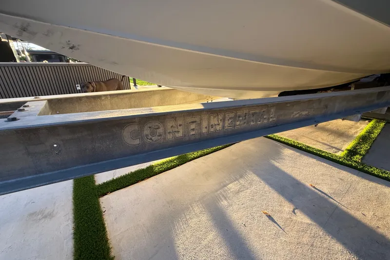 Slide: The Image of 2005 Formula 330 Sun Sport boat on Continental trailer, parked on concrete. - 14