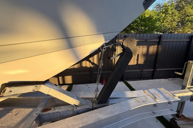 Slide: The Image of 2005 Formula 330 Sun Sport boat on trailer, close-up of bow and hitch mechanism. - 15