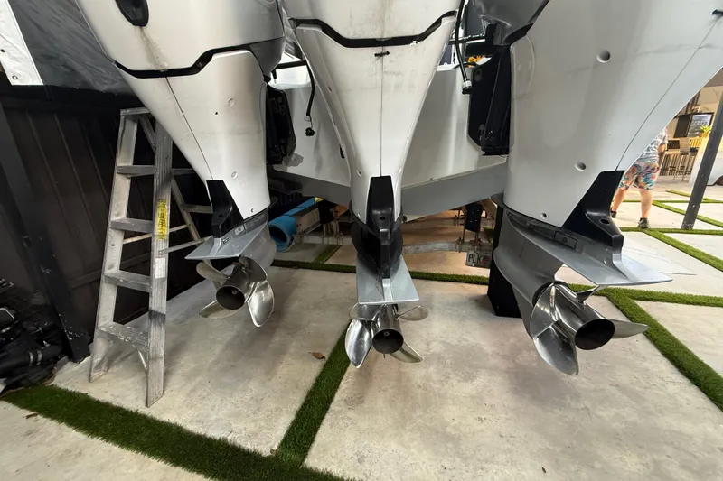 Slide: The Image of Rear view of a 2005 Formula 330 Sun Sport boat with triple outboard engines. - 20