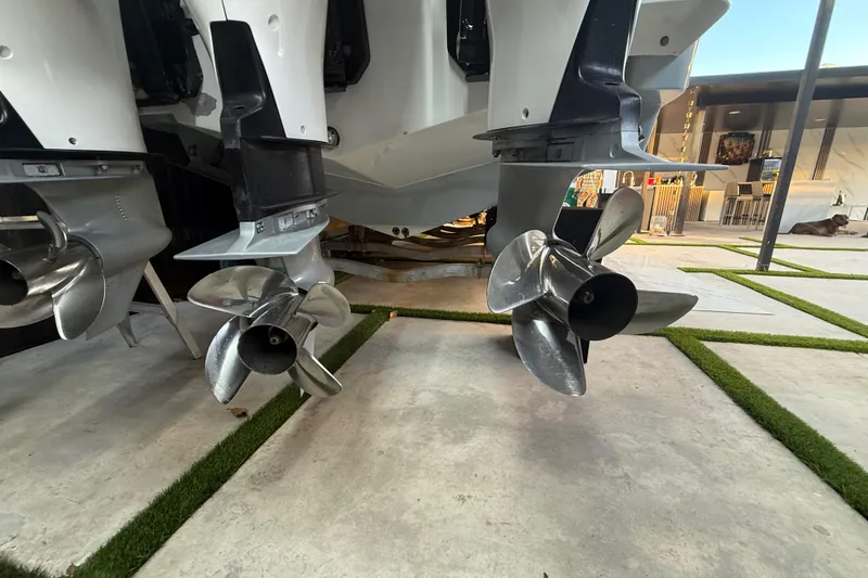 Slide: The Image of Propellers of a 2005 Formula 330 Sun Sport boat on display in a modern setting. - 21