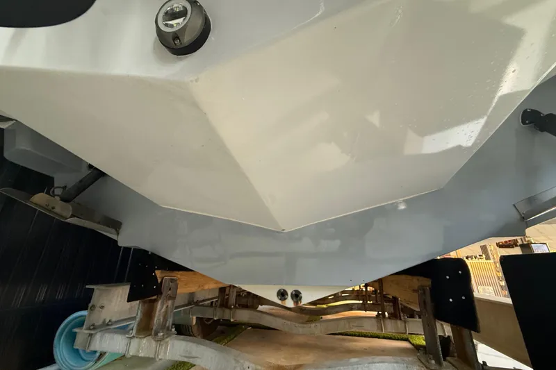 Slide: The Image of Underside view of a 2005 Formula 330 Sun Sport boat on a trailer. - 25