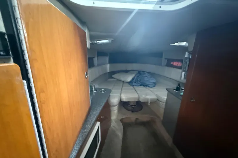 Slide: The Image of Interior cabin of a 2005 Formula 330 Sun Sport boat with seating and bedding. - 32