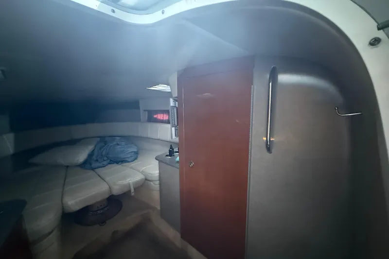 Slide: The Image of Interior cabin of 2005 Formula 330 Sun Sport boat with seating and storage. - 34
