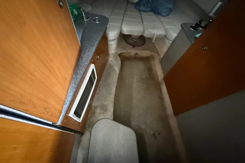 Slide: The Image of Interior cabin of a 2005 Formula 330 Sun Sport boat with kitchenette and seating area. - 35