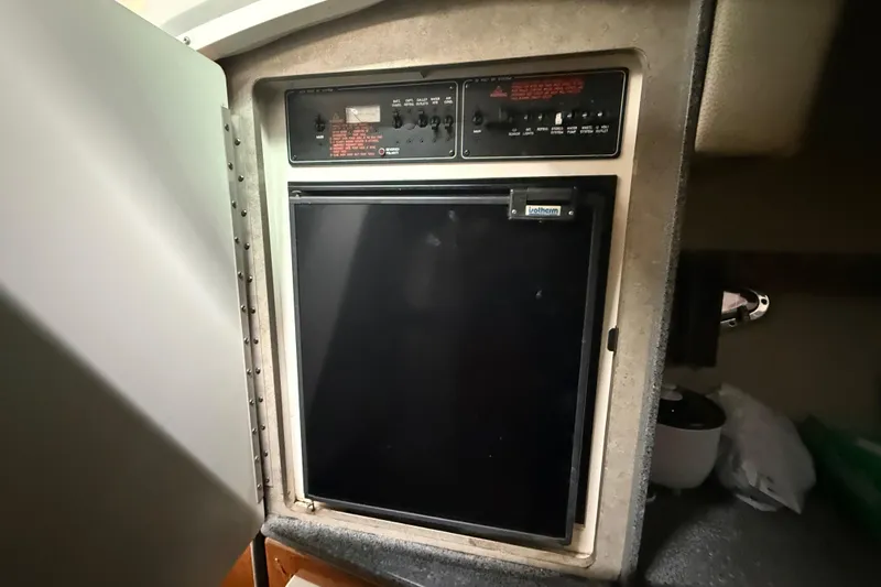 Slide: The Image of 2005 Formula 330 Sun Sport cabin refrigerator with control panel. - 38