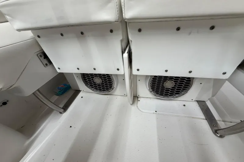 Slide: The Image of 2005 Formula 330 Sun Sport boat interior with speakers and white seating. - 42
