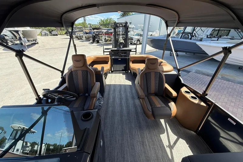Slide: The Image of 2026 Bennington 22 M Quad Bench pontoon boat interior with luxurious seating and modern design. - 11