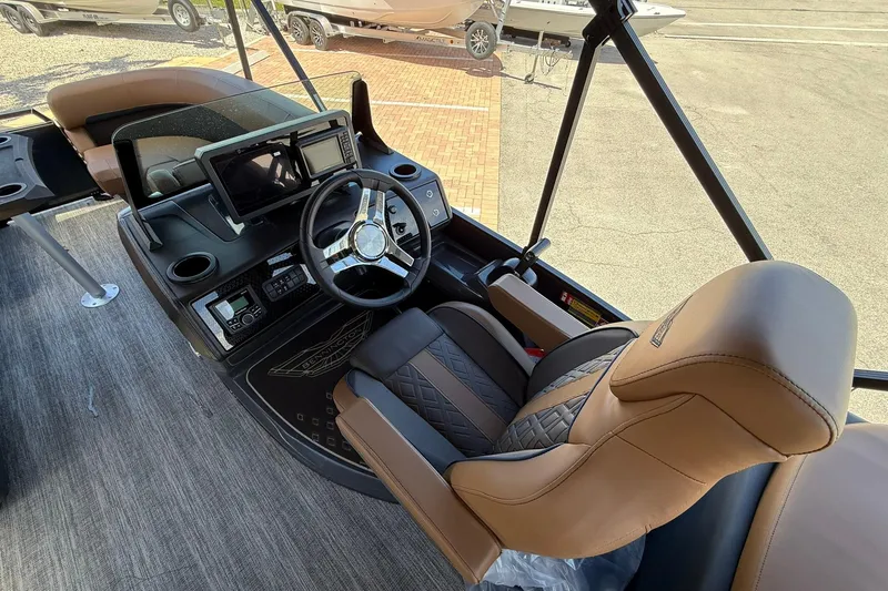 Slide: The Image of Interior of 2026 Bennington 22 M Quad Bench boat with modern helm and luxurious seating. - 7